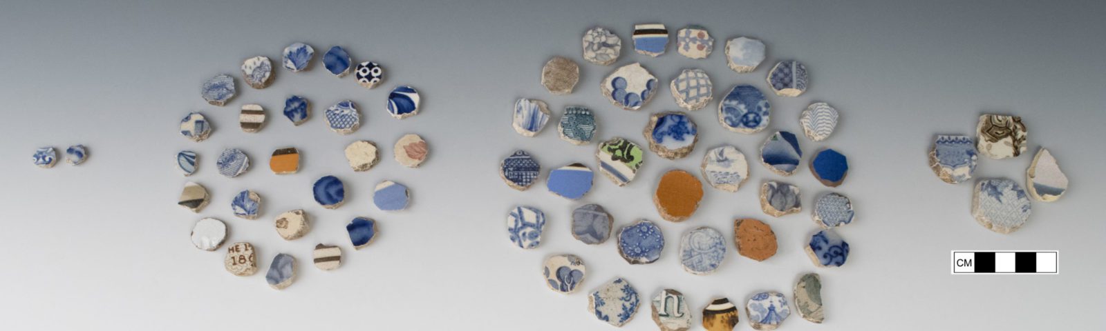Shaped ceramic gaming pieces organized into circular arrangements
