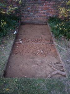 View to north of Test Units 246 and 247 with Layer D (brick path layer) that likely dates to the 1930s. Photo credit: DATA Investigations.